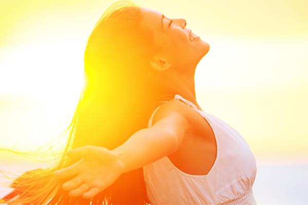 Woman enjoying sunset photo